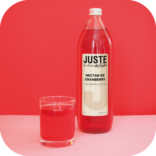 Bouteille en verre de nectar de cranberry de couleur rose rouge bordeaux 25 cl de face verre rose -  Juste le Choix du Fruit