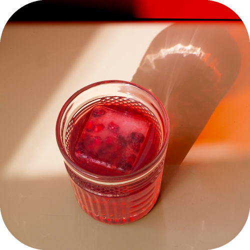 Verre de nectar de framboise de couleur rouge rose fuschia 25 cl de face verre glaçon  Juste le Choix du Fruit